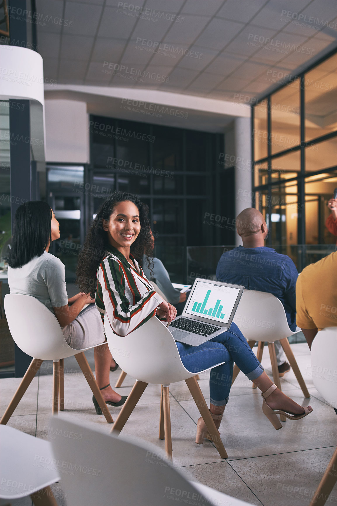 Buy stock photo Shot of a young businesswoman using a laptop during a conference at work