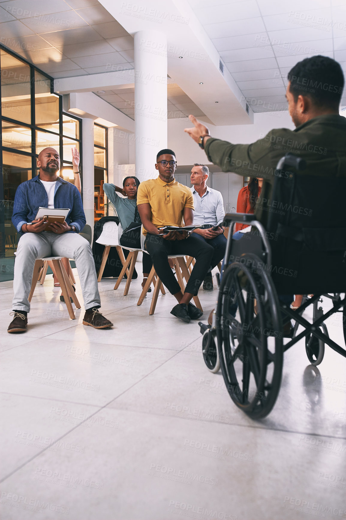 Buy stock photo Shot of a group of businesspeople attending a conference at work