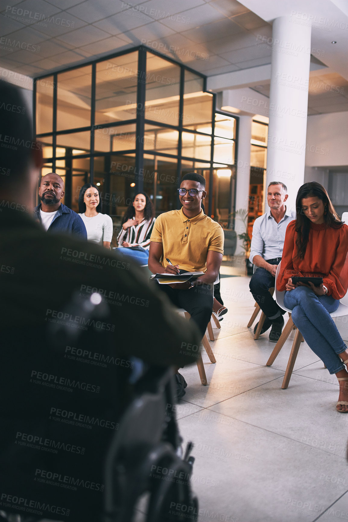 Buy stock photo Shot of a group of businesspeople attending a conference at work