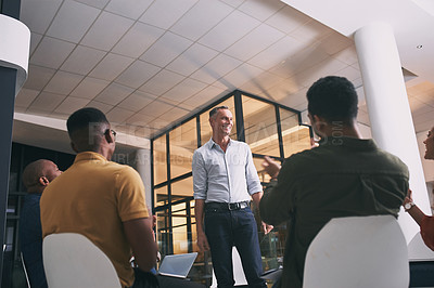 Buy stock photo Shot of a team of staff applauding during a meeting