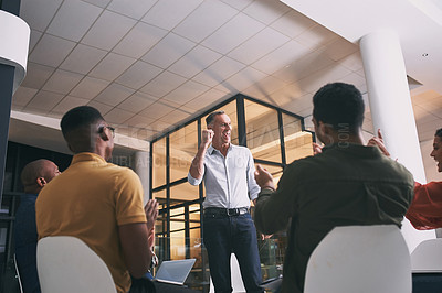 Buy stock photo Shot of a team of staff applauding during a meeting