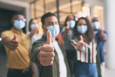 Buy stock photo Shot of a team of colleagues giving the thumbs up