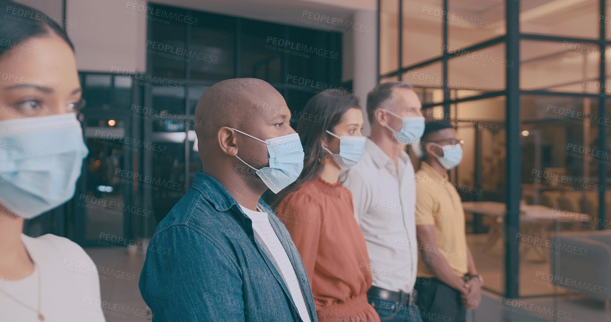 Buy stock photo Shot of a team of coworkers in their office during lockdown