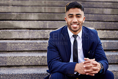 Buy stock photo Shot of a young businessman enjoying the day sitting on some stairs