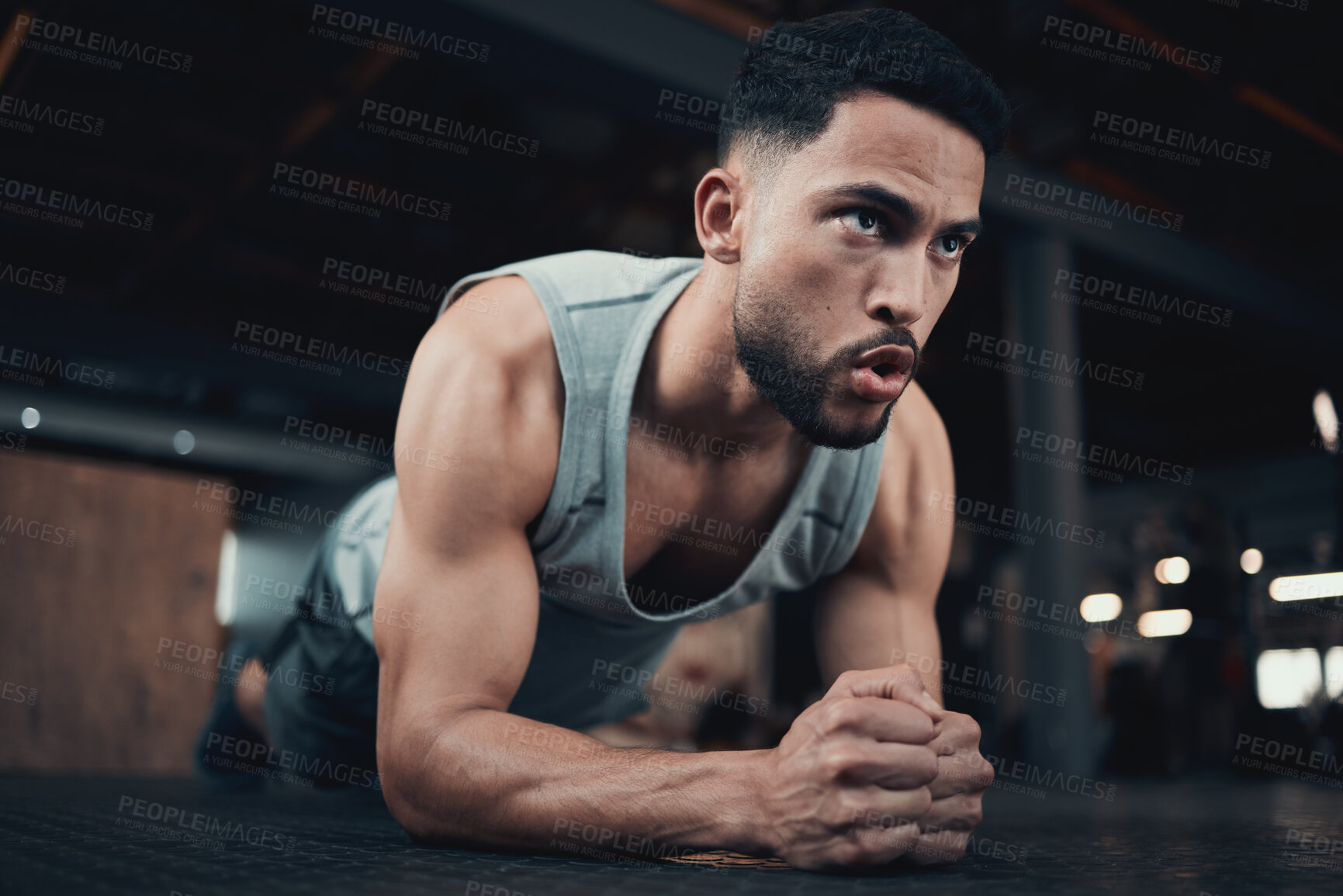 Buy stock photo Shot of a handsome young man doing a plank