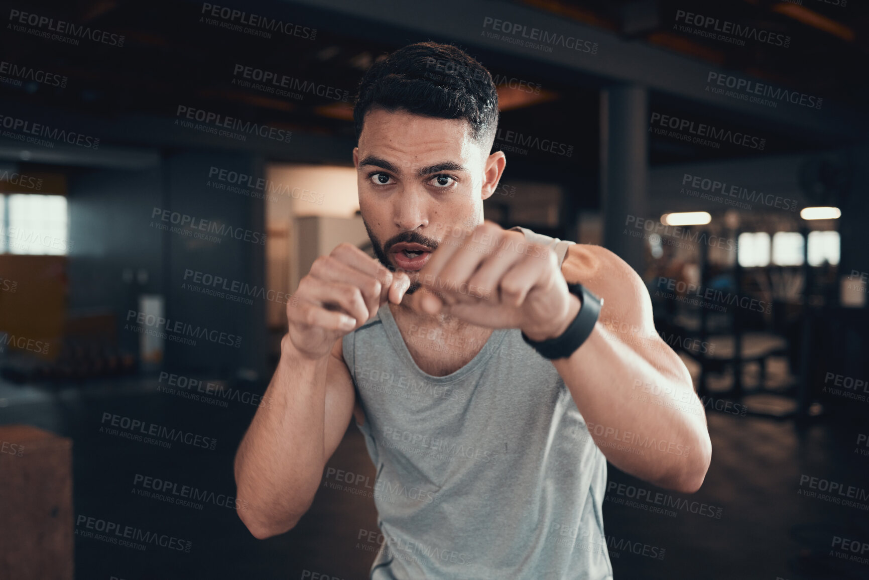 Buy stock photo Boxing, portrait and hands of man in gym for exercise challenge, competition or martial arts. Fitness, athlete and serious male person with punch for performance, self defence or strength workout