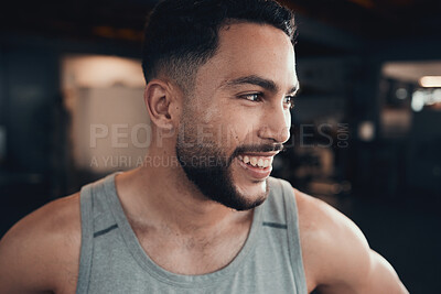 Buy stock photo Shot of a young man taking a break during a gym workout