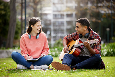 Buy stock photo Shot of two students sitting together on campus