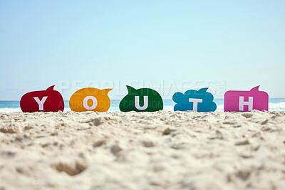 Buy stock photo Shot of speech bubbles spelling out a word on the seashore