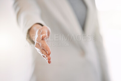 Buy stock photo Cropped shot of an unrecognizable businesswoman standing with her arm extended for a handshake