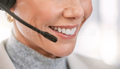 Buy stock photo Cropped shot of an unrecognizable female call center agent wearing a headset while working in the office