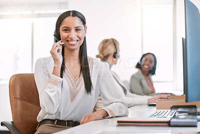 Buy stock photo Cropped portrait of an attractive young female call center agent wearing a headset while working in her office
