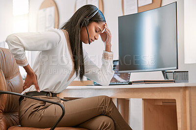 Buy stock photo Cropped shot of an attractive young female call center agent suffering with back pain while working on her computer in the office
