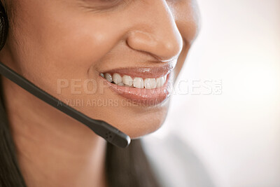 Buy stock photo Cropped shot of an unrecognizable female call center agent wearing a headset while working in the office