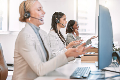 Buy stock photo Cropped shot of a group of female call center agents wearing headsets and working on their computers in the office
