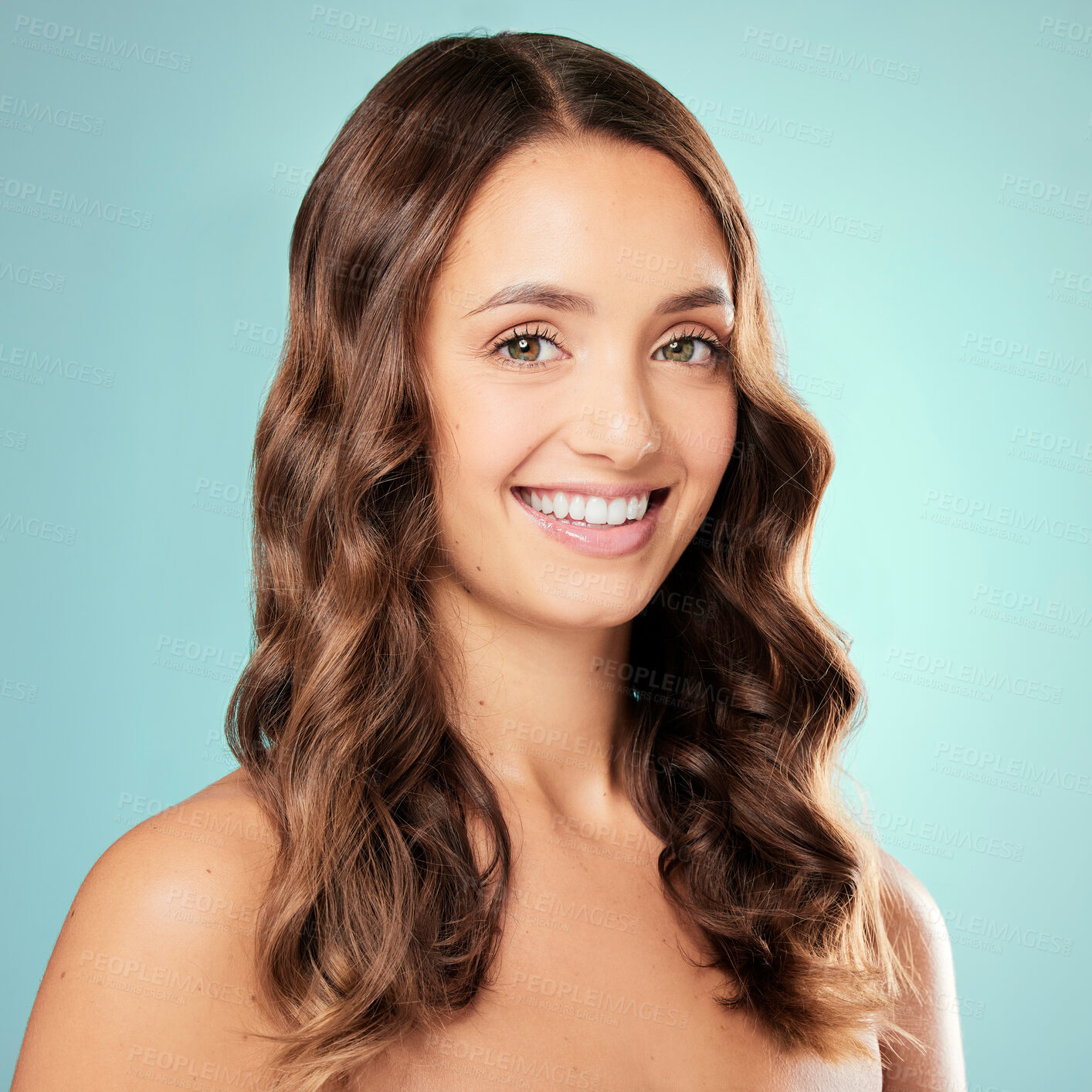 Buy stock photo Happy woman, portrait or hair care in studio with curls for texture, healthy growth or glow on blue background. Female person, wavy style and shine for salon aesthetic, beauty and keratin results