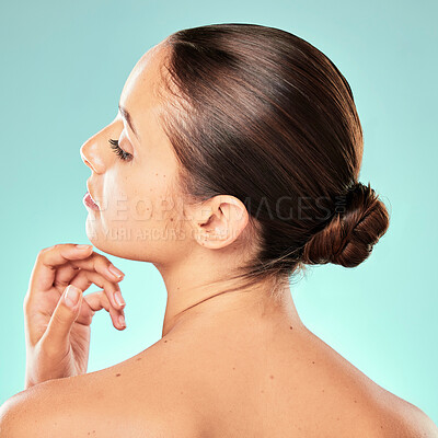 Buy stock photo Face, back and woman with skincare for beauty on blue background with smooth shine or natural glow. Healthy, confident model or proud girl in studio with cosmetics, hydration or wellness for results