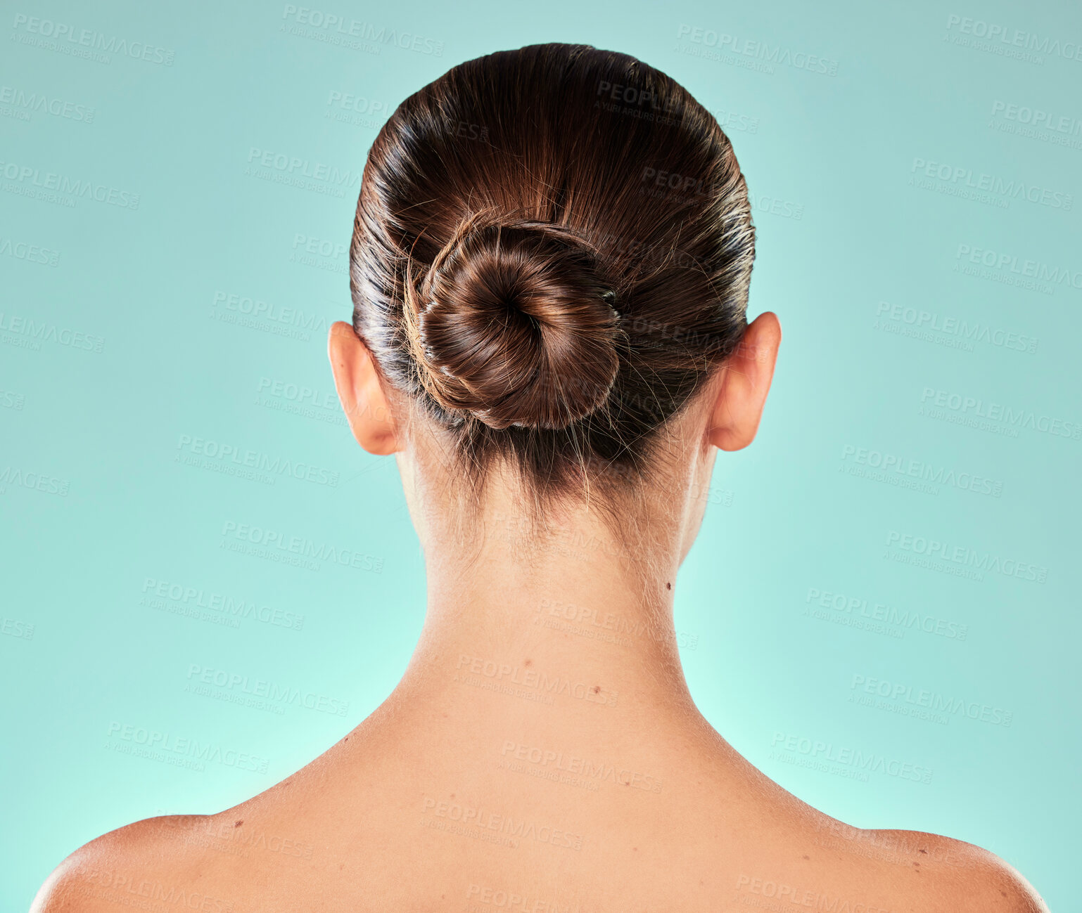 Buy stock photo Salon, hair care and woman in studio for texture, keratin treatment or natural shine on blue background. Back view body and female model with bun hairstyle for aesthetic, cosmetics or shampoo