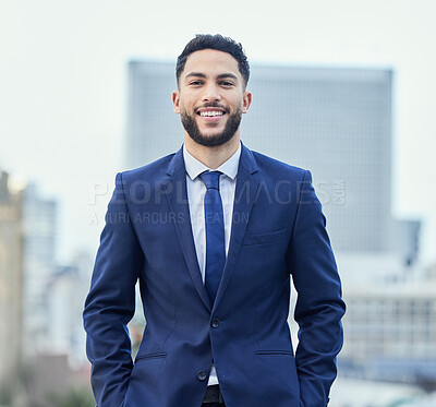 Buy stock photo Cropped portrait of a handsome young businessman standing outside in the city with his hands in his pockets