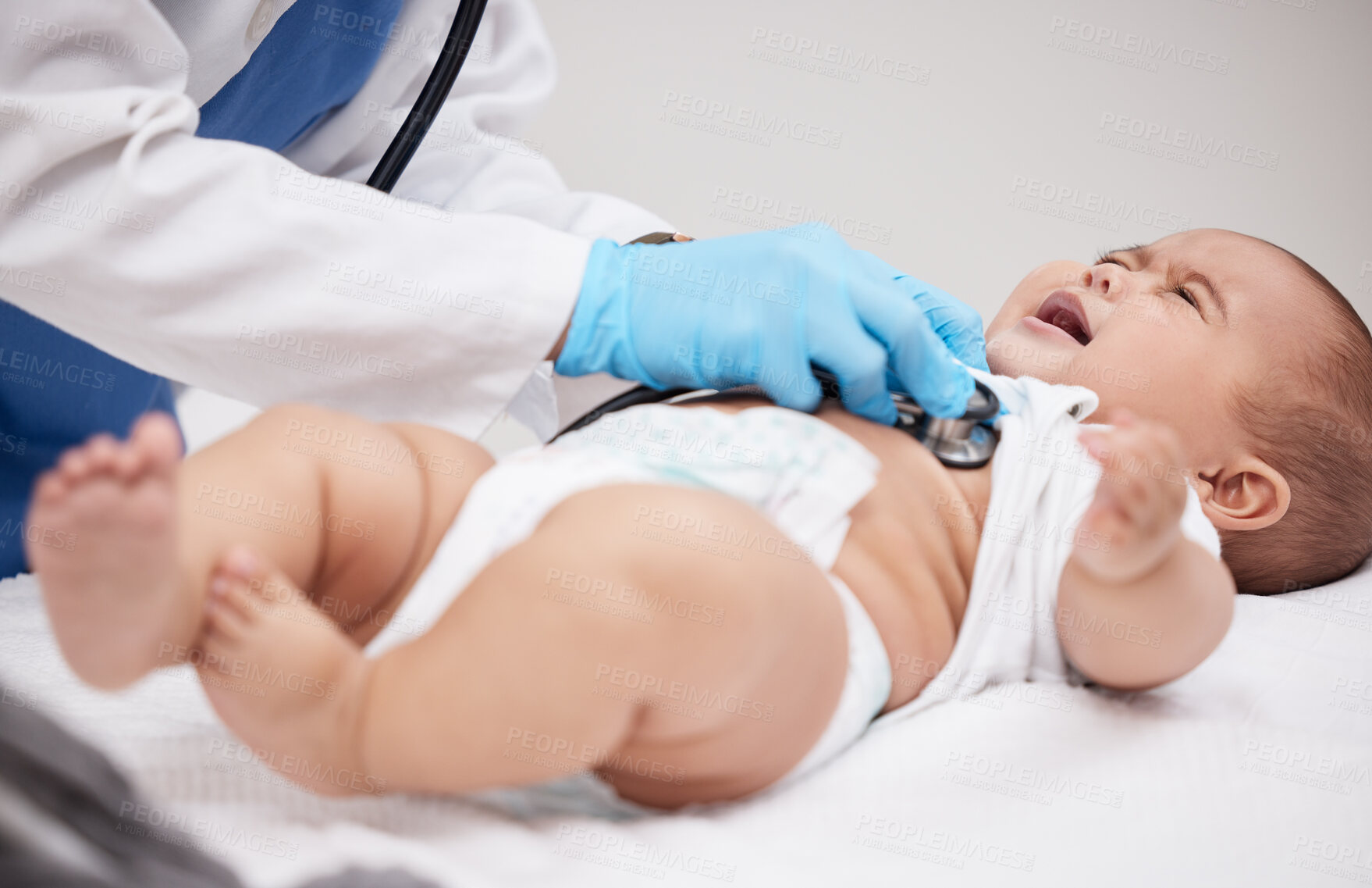 Buy stock photo Baby, doctor and stethoscope for crying and heartbeat, checkup and lungs for healthcare in hospital. Pediatrician, medic and infant for examination for young person, child and hands for physician

