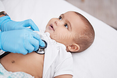Buy stock photo Shot of a little baby having its chest checked by a female doctor