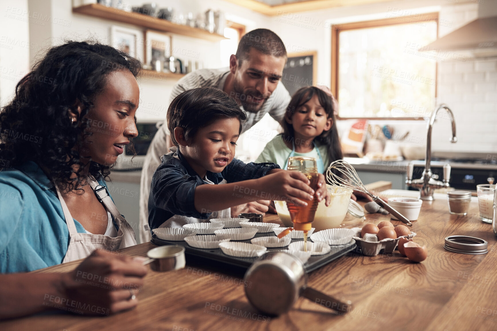 Buy stock photo Baking, morning and parents with child in kitchen for bonding, food and learning. Cooking, smile and cupcake with people and ingredients in family home for breakfast, teaching and happiness together