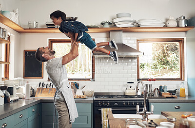 Buy stock photo Shot of a man spending quality time at home with his young son