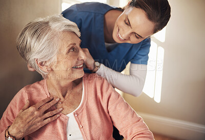 Buy stock photo Shot of a senior woman in a wheelchair being cared for a nurse