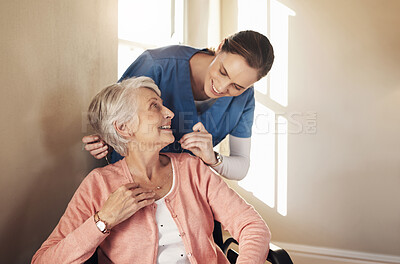 Buy stock photo Shot of a senior woman in a wheelchair being cared for a nurse