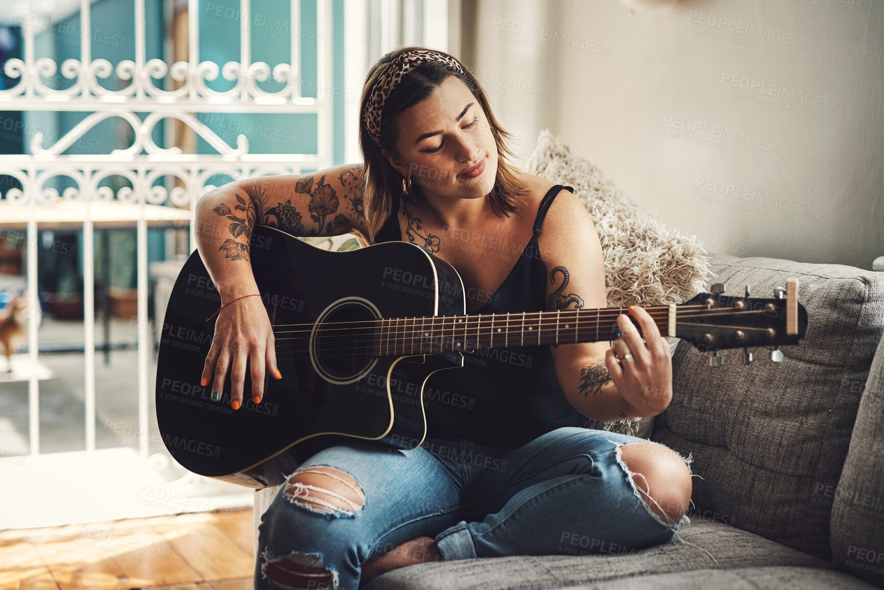 Buy stock photo Woman, relax and guitar in home for music, practice and learning chords on sofa. Musician, string instrument and strumming in living room with talent, pitch development or rehearsal for performance