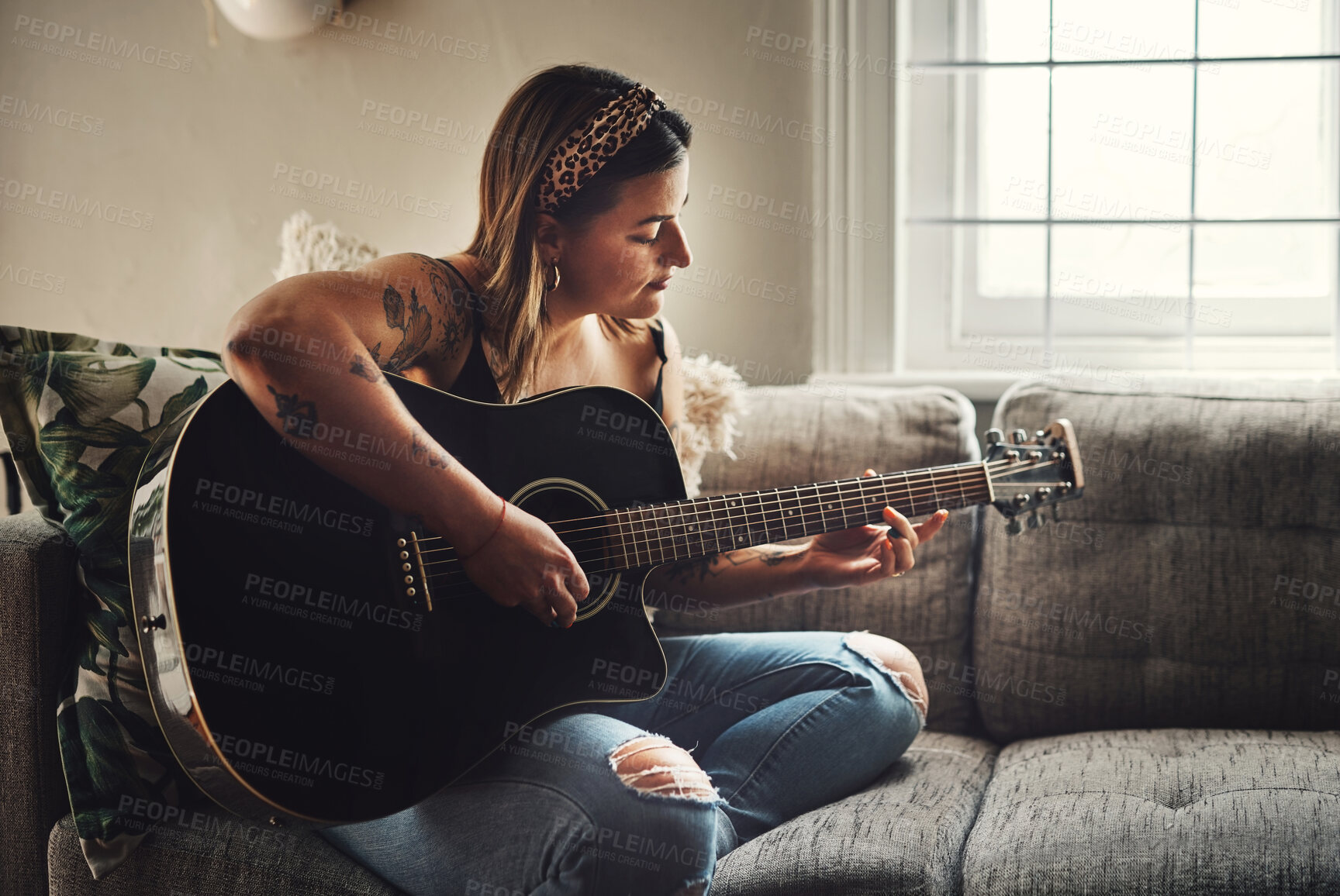 Buy stock photo Girl, relax and guitar in home for music, practice or learning chords on sofa. Musical woman, string instrument or strumming in living room with talent, pitch development or rehearsal for performance