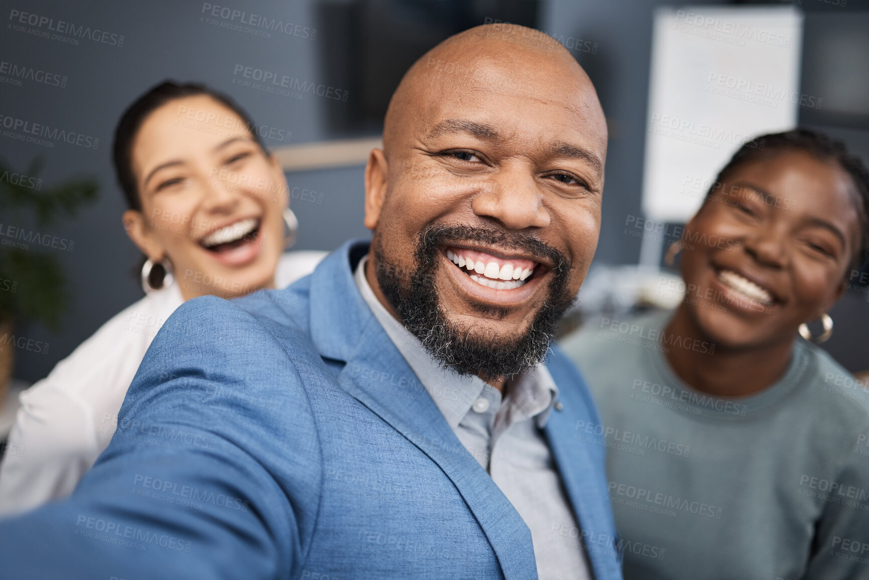 Buy stock photo Portrait of a group of businesspeople taking selfies together in an office