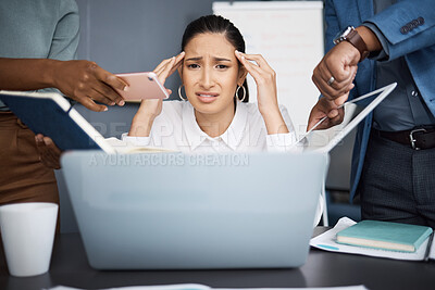 Buy stock photo Shot of a young businesswoman looking stressed out in a demanding office environment