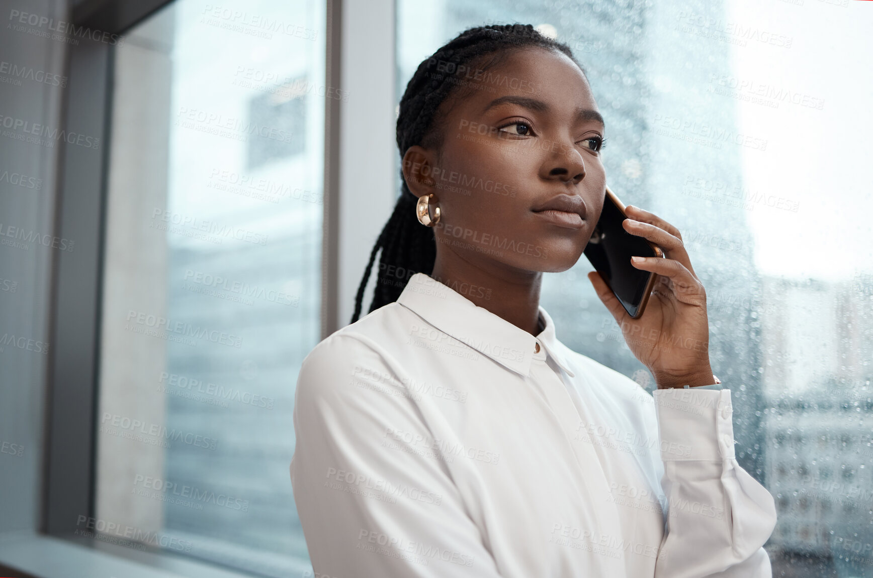 Buy stock photo Shot of a businesswoman talking on her cellphone