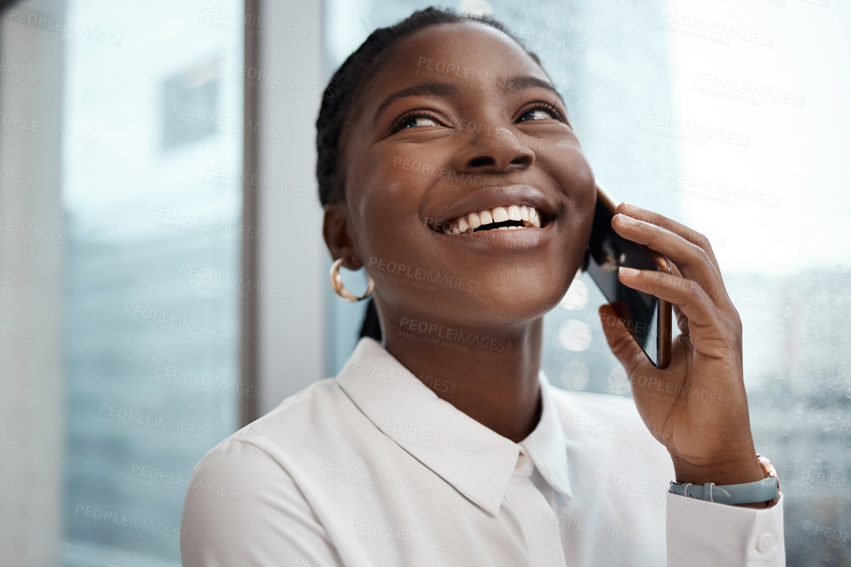 Buy stock photo Shot of a businesswoman talking on her cellphone