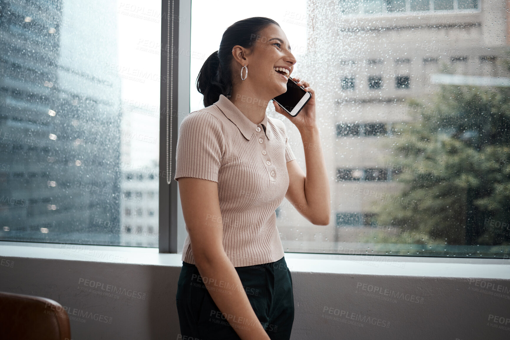 Buy stock photo Woman, phone call and funny conversation in office, journalist laughing and quote for media. Female person, reporter discussion and online for hearing information, publishing joke and news worker
