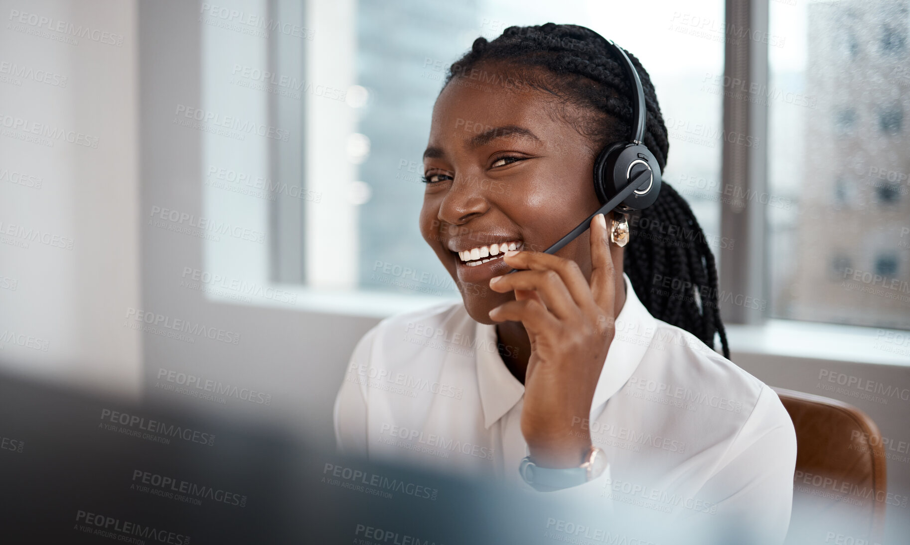 Buy stock photo Shot of a call center agent working at her desk