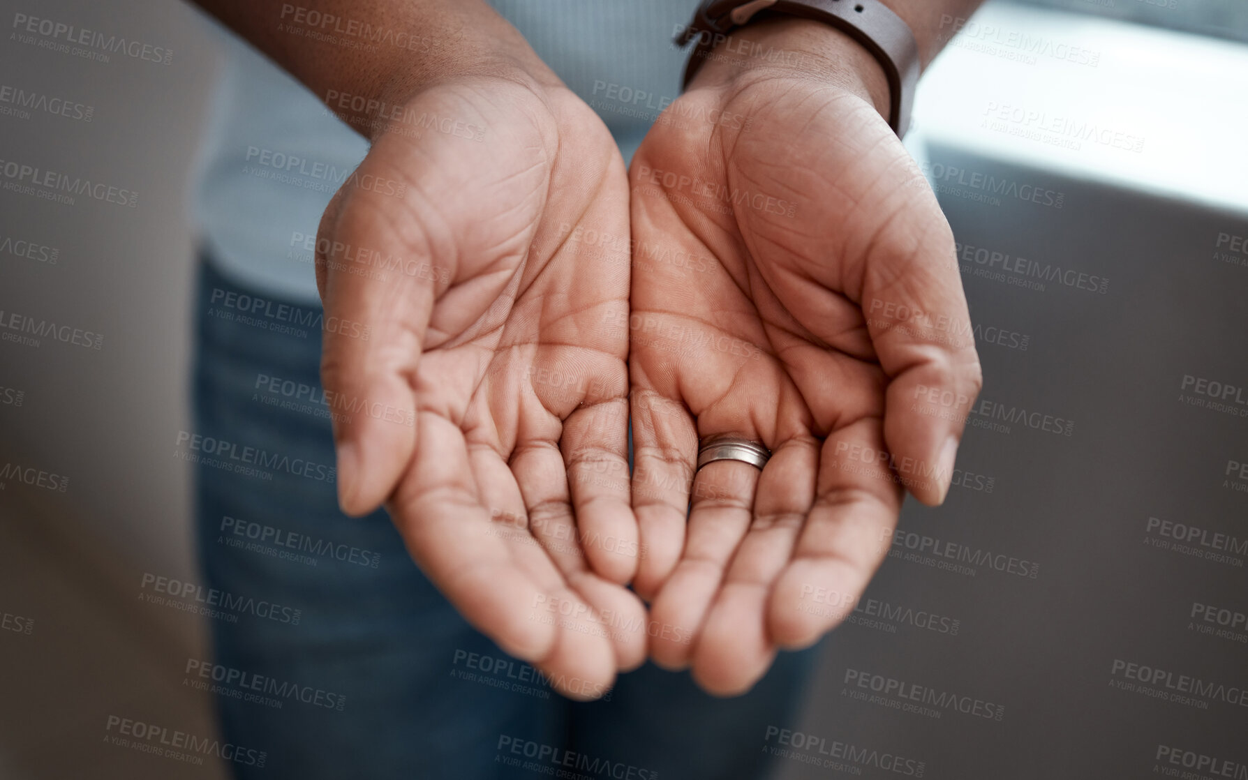 Buy stock photo Cropped shot of a businessman standing with his hands cupped together