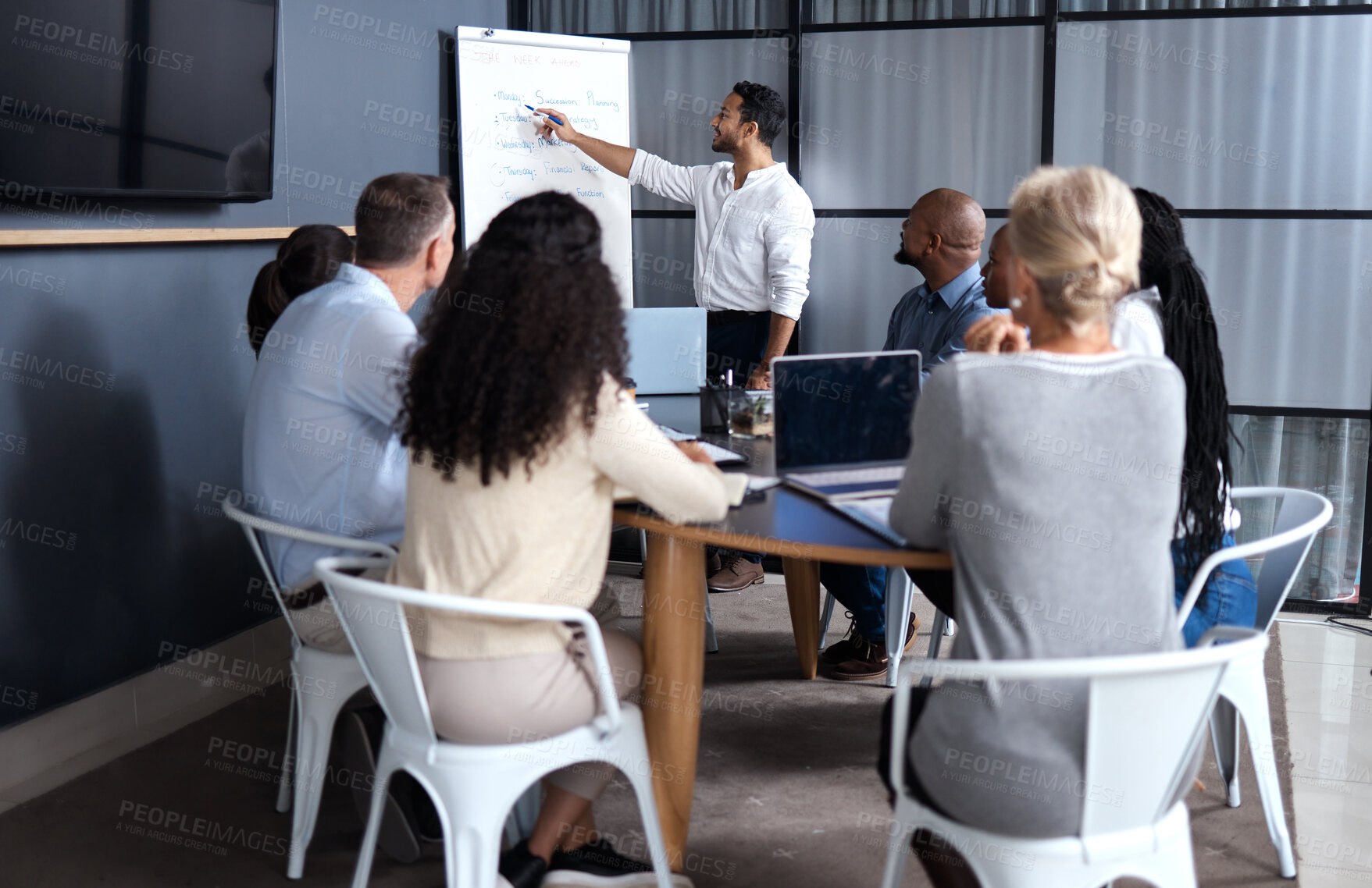 Buy stock photo Shot of a group of businesspeople in a meeting at work