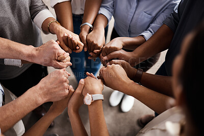 Buy stock photo Shot of a group of unrecognizable businesspeople holding hands at work