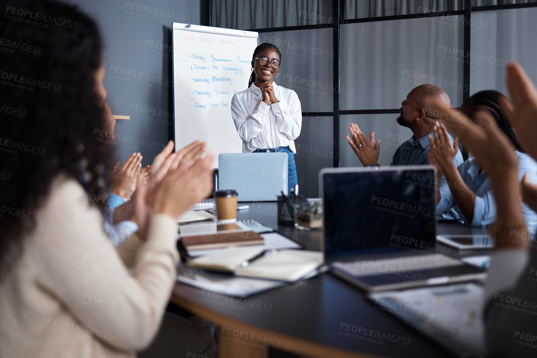 Buy stock photo Shot of a group of businesspeople clapping hands in a meeting at work