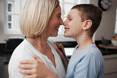Buy stock photo Shot of a mother and son hugging and being affectionate