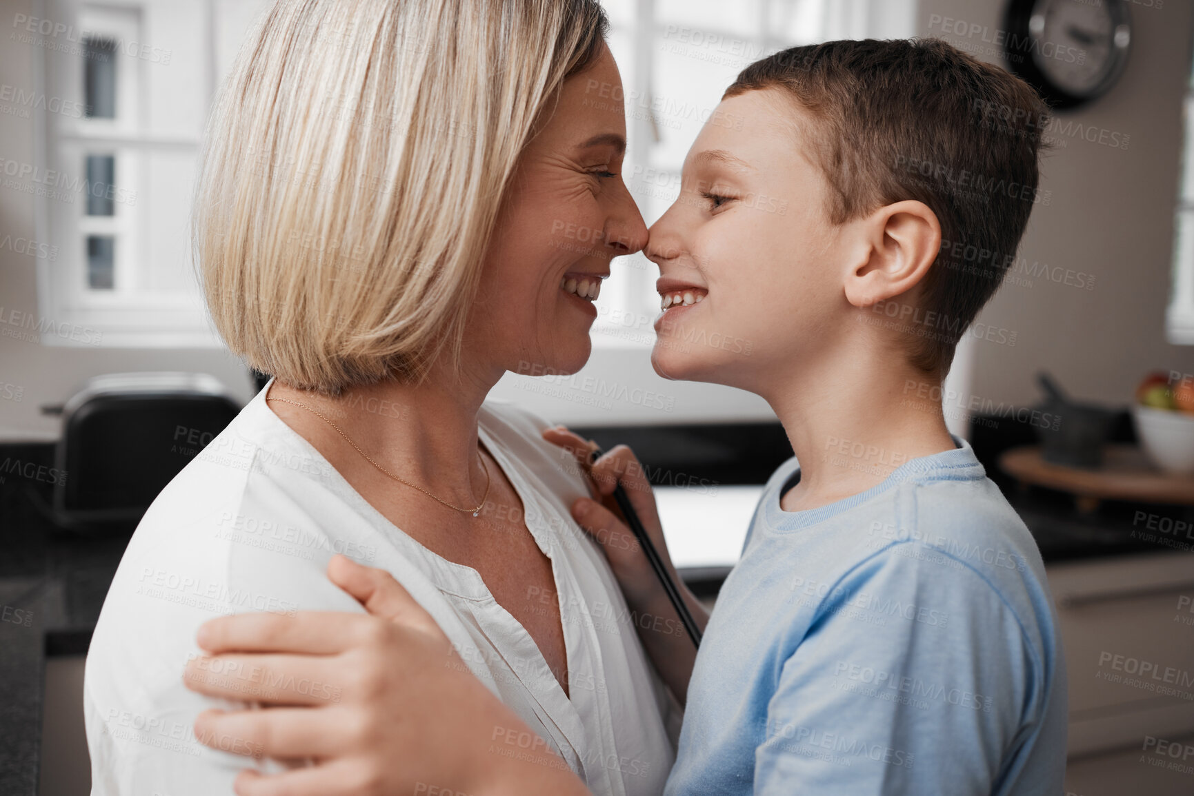 Buy stock photo Shot of a mother and son hugging and being affectionate