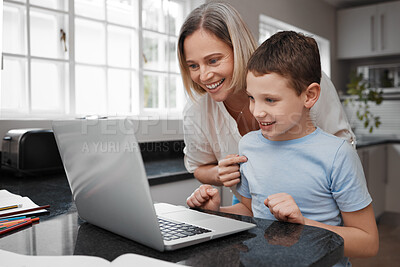 Buy stock photo Shot of a mother and son team using a laptop to complete home schooling work