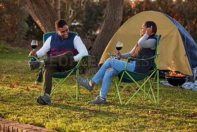 Buy stock photo Happy, couple and wine by camping in outdoor to celebrate anniversary with love or bonding together. Smile, man and woman on adventure in nature to relax with alcohol for valentines day on vacation