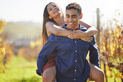 Buy stock photo Man, woman and piggy back at vineyard for smile, walking and playful with connection in summer. Happy couple, hug and excited on adventure in countryside, wine farm and nature with love on holiday