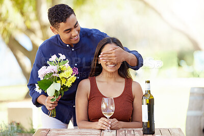 Buy stock photo Man, woman and surprise with flowers, outdoor and cover eyes at restaurant with wine glass on date. Happy couple, gift and floral bouquet for romance, anniversary and love with alcohol on vacation