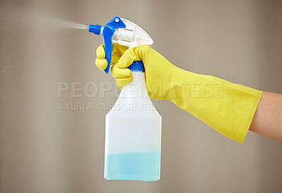 Buy stock photo Hand, cleaning and spray for house work, home hygiene and spring clean in apartment with gloves. Hands, bottle spraying and washing product for housekeeper, maid and health protection from virus