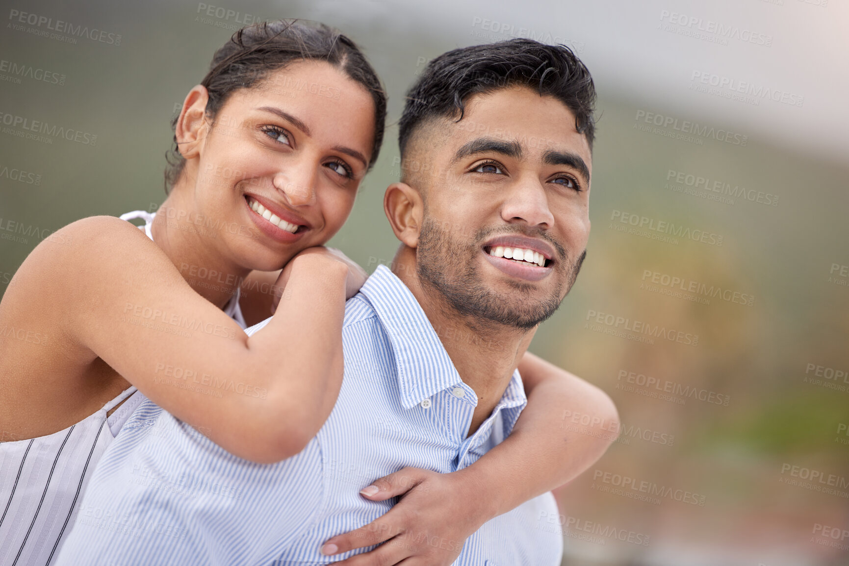 Buy stock photo Shot of a young couple spending time at the beach