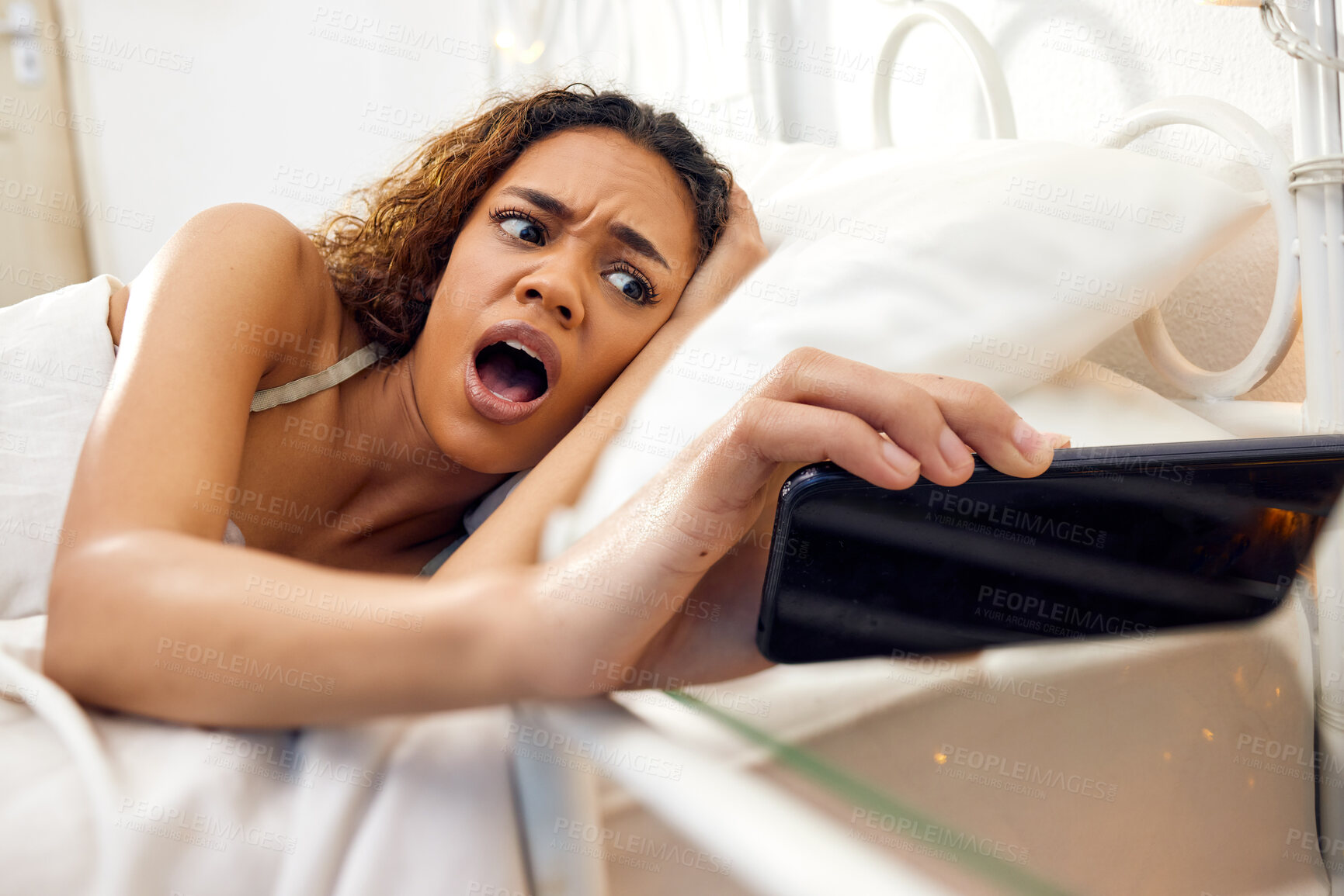 Buy stock photo Late, time and girl morning with surprise, stress or anxiety from phone clock and overslept. Woman, shocked and wake up in bedroom with alarm, schedule alert or notification of hour with smartphone